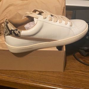 Stylish white raven shoes with cute design. Size 8.5. Never worn still in box.